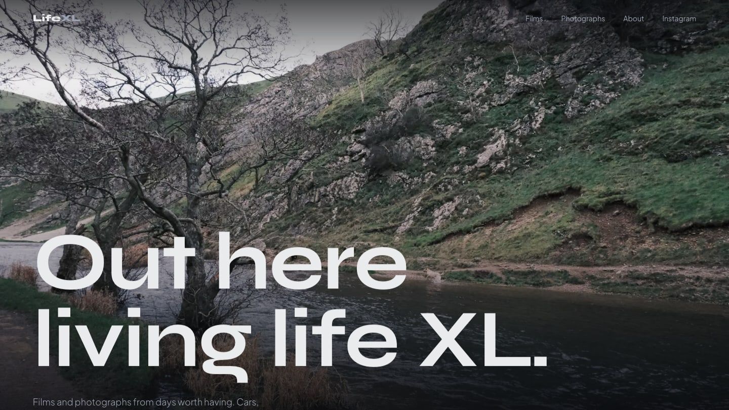 LifeXL homepage, a coastal landscape under the line Out here living life XL